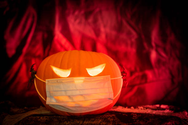 istock Halloween Pumpkin wearing a Coronavirus Facemask 1281416383