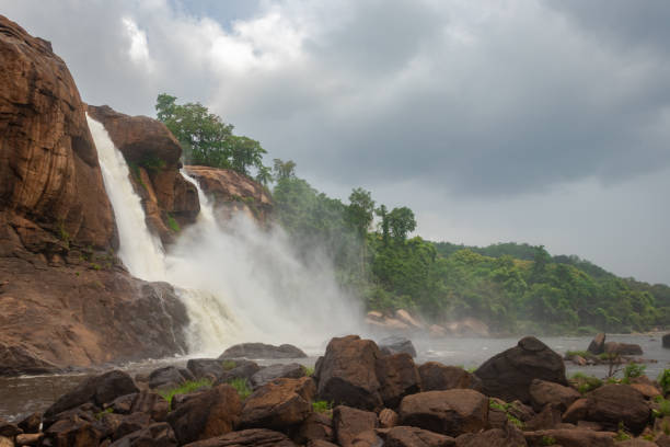 istock waterfall falling from mountain too at morning from low angle 1281421634