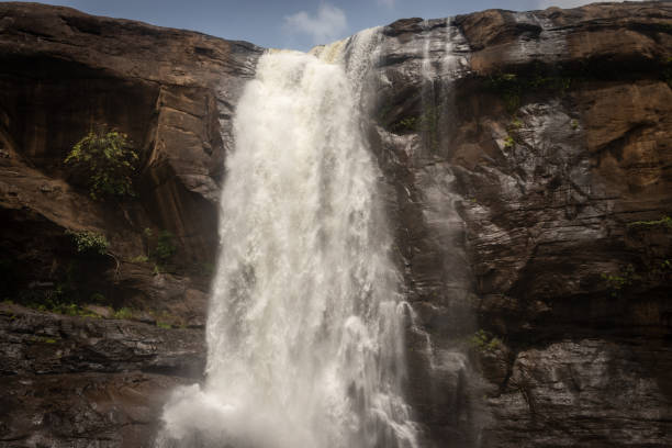 istock waterfall falling from mountain too at morning from low angle 1281421659