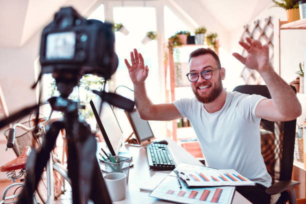 istock Happy Freelancer Saying Hello To Audience During Vlog Lesson 1281422551