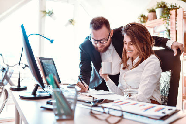 istock Businessman Showing His Partner How To Calculate Risk 1281423321