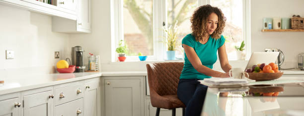 working from home working from home bar stool photos stock pictures, royalty-free photos & images