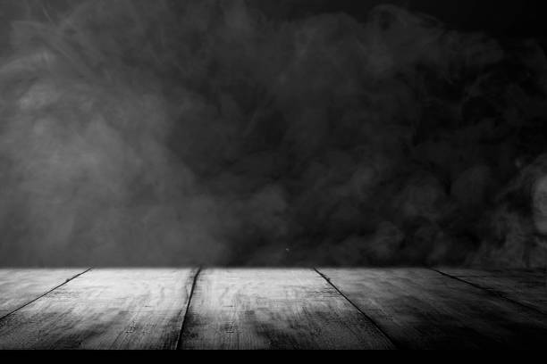 istock Wooden table with smoke and light 1281424078