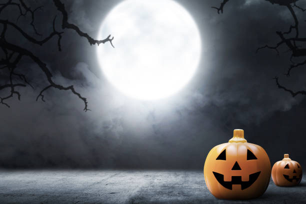 istock Jack-o-Lantern on the concrete floor with smoke 1281424253