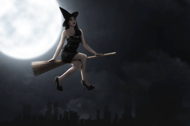 Asian witch woman with hat flying on a magic broomstick with a full moon background