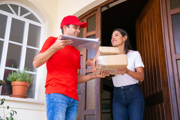 istock Cheerful Latin female client receiving parcels and smiling 1281425133
