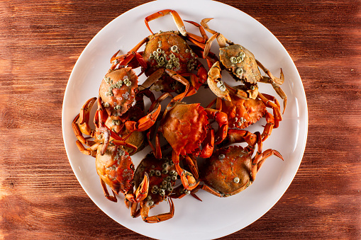 plate with boiled crabs and crab meat