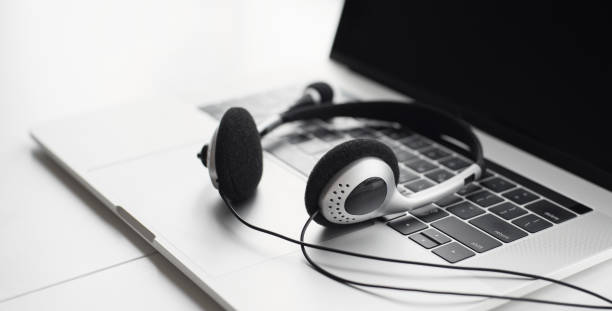 istock Place of work. Laptop with headset at desk 1281425550