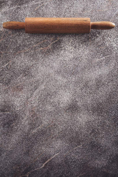 istock Rolling Pin on Woooden Floured Background 1281428077