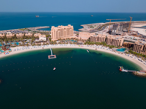 Aerial view of beach road and resorts of Marjan Island in the emirate of Ras al Khaimah in United Arab Emirates