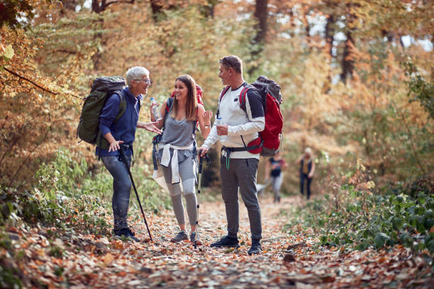 istock Friends chatting at a break from hiking 1281428559