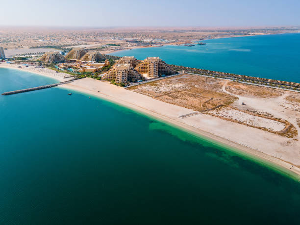 Marjan Island in the emirate of Ras al Khaimah in UAE aerial view Aerial view of beach road and resorts of Marjan Island in the emirate of Ras al Khaimah in United Arab Emirates dubai island stock pictures, royalty-free photos & images
