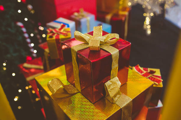 istock Christmas gift boxes with evergreen garland 1281431317