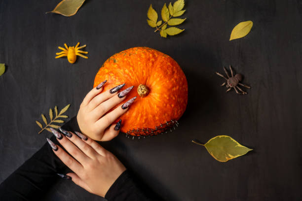 istock Halloween Nail Art Design, hands and decorations. 1281432733