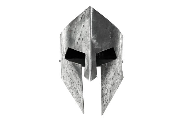 Ancient iron spartan head protection isolated on white. Front view of ancient iron spartan helmet isolated on white studio background. Medieval armor, archeological souvenir from past times, metal tough head protective clothes. face guard sport photos stock pictures, royalty-free photos & images