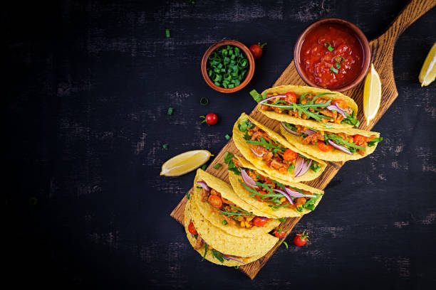 istock Taco. Mexican tacos with beef meat, corn and salsa. Mexican cuisine. Top view, flat lay, copy space. 1281435533