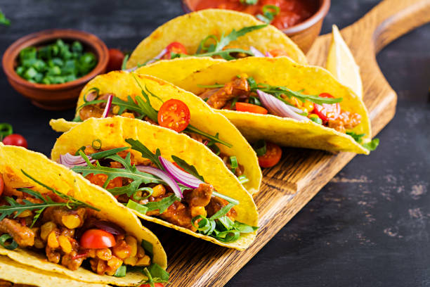 istock Taco. Mexican tacos with beef meat, corn and salsa. Mexican cuisine. copy space. 1281435537
