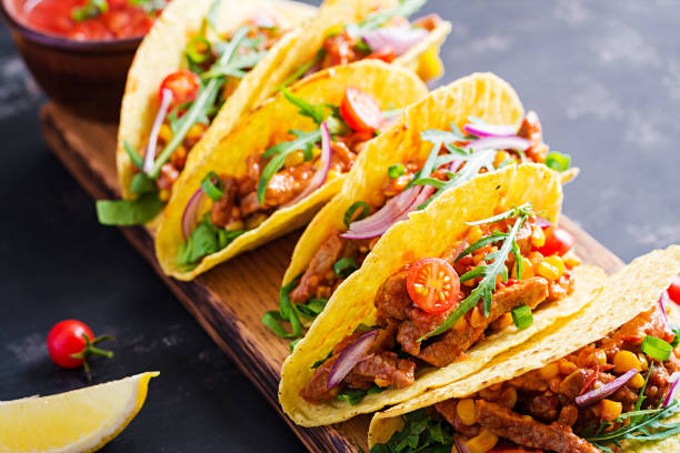 istock Taco. Mexican tacos with beef meat, corn and salsa. Mexican cuisine. copy space. 1281435548