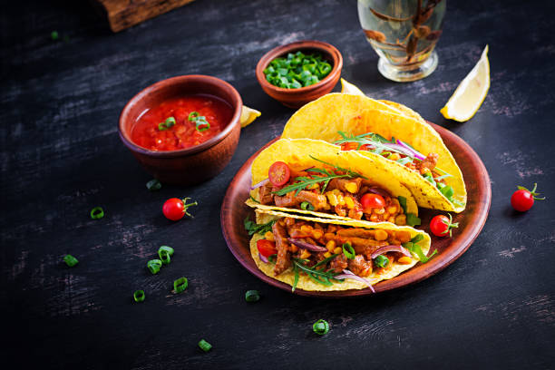 istock Taco. Mexican tacos with beef meat, corn and salsa. Mexican cuisine. copy space. 1281435556