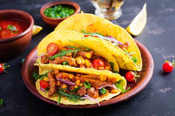 istock Taco. Mexican tacos with beef meat, corn and salsa. Mexican cuisine. copy space. 1281435563