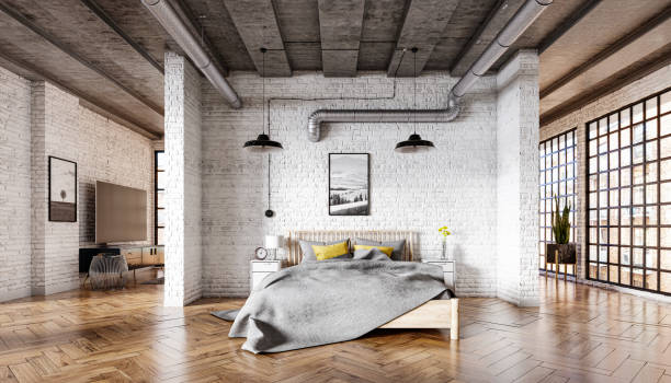 Bedroom in a loft interior with a brick wall, parquet floor and a concrete ceiling Bedroom in a loft interior with a brick wall, parquet floor and a concrete ceiling industrial style photos stock pictures, royalty-free photos & images