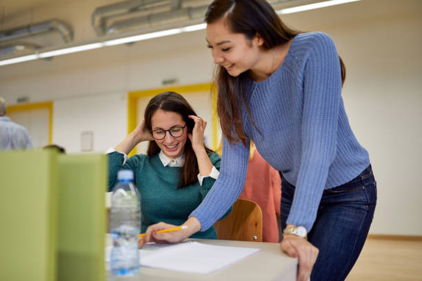 istock Female student helping female colleague about the lesson 1281437005