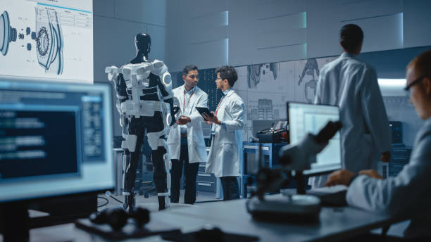 istock In Robotics Development Laboratory International Team of Engineers and Scientists Work on Robotics Exoskeleton Prototype. Designing Powered Exosuit to Help Disabled People Walk, Workers to Lift Goods 1281439973