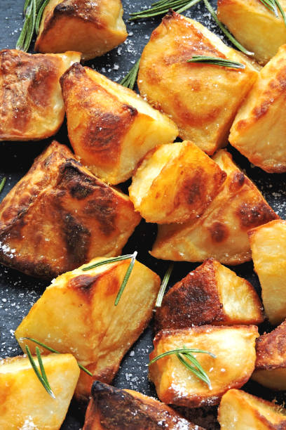 istock Baked potato pieces. Potatoes in a rustic style. 1281440132
