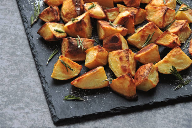 istock Baked potato slices. Potatoes in a rustic style. 1281440152