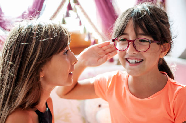 istock Cute little girls enjoying at homet 1281440336