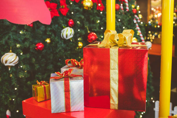istock Christmas gift boxes with evergreen garland 1281441314