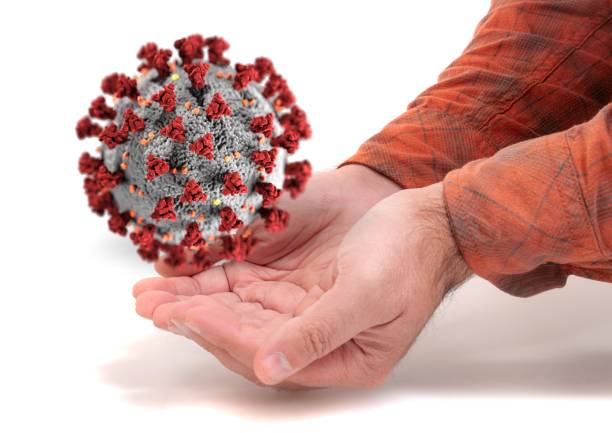 istock Male hand with 3D covid-19 virus 1281441951