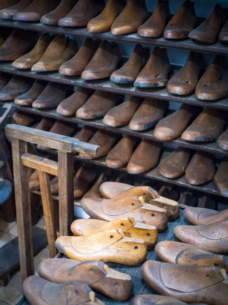 istock Shoemakers model for shoes in his workshop 1281442755