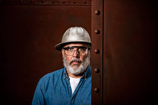 istock Portrait of a male construction worker between steel plates 1281445896