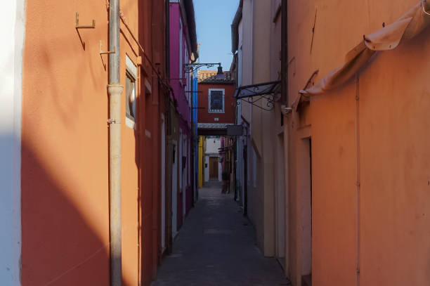 istock Quiet alley with orange wall houses. 1281446857