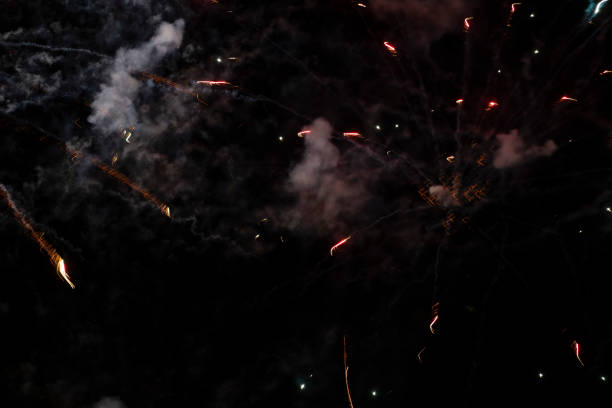 istock Smoke and spots of fireworks on a black background. 1281447509