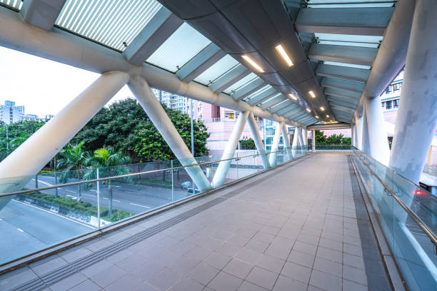 istock Modern empty foot bridge in the street. Building abstract background 1281448394