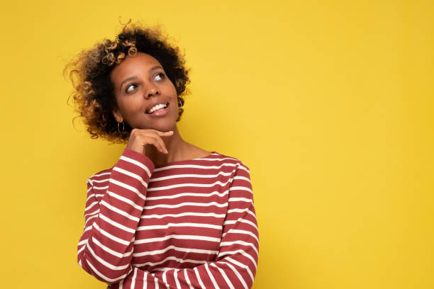 istock Young African American woman thinking, looking up 1281450875
