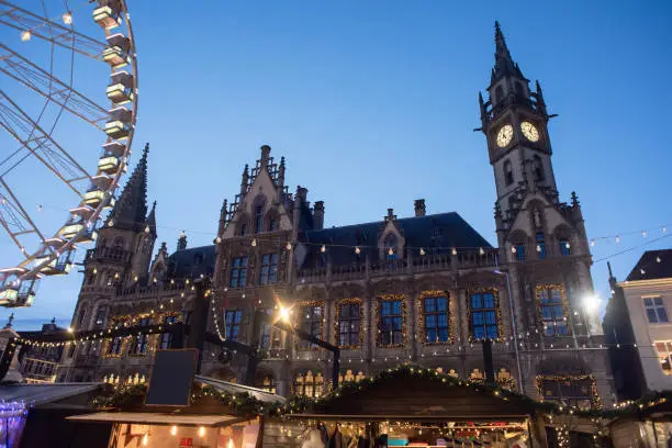 Gift shops at Christmas fair, Ghent main square. Holidays concept