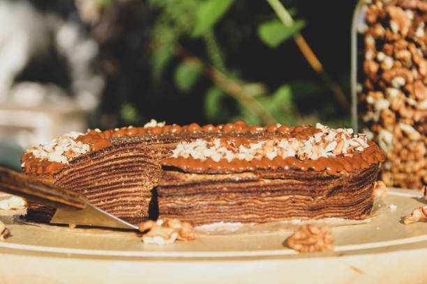 istock Chocolate pancake cake with nuts. Pie close-up. 1281452538