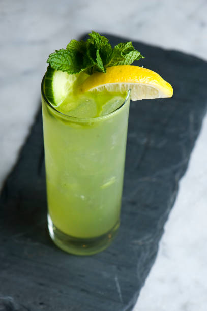 Mojito. Classic Cocktail. Alcoholic Drink made with rum, gin, vodka, rum or whiskey mixed with mint, lime juice sugar and soda water and garnished with limes and cherries. Classic American bar drinks.