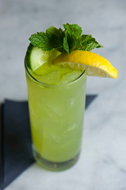 Mojito. Classic Cocktail. Alcoholic Drink made with rum, gin, vodka, rum or whiskey mixed with mint, lime juice sugar and soda water and garnished with limes and cherries. Classic American bar drinks.