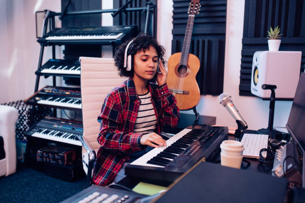 istock Girl composing music in the music studio 1281455380