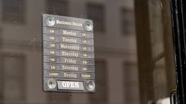 istock Opening times sign in a shop window 1281455435