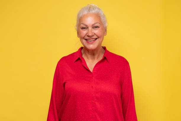 istock Smiling middle aged mature beautiful woman looking at camera. 1281455468