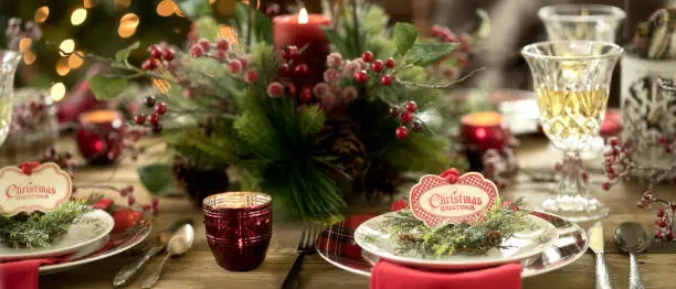 Elegant Holiday Dining Table Place Setting in Front of the Christmas Tree