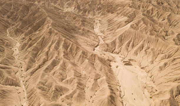 istock Dryness land with erosion terrain, geomorphology background. 1281456254