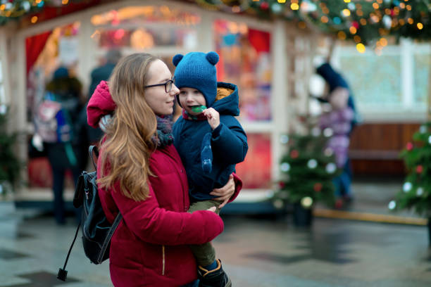 istock Mother and son at a Christmas market 1281461105
