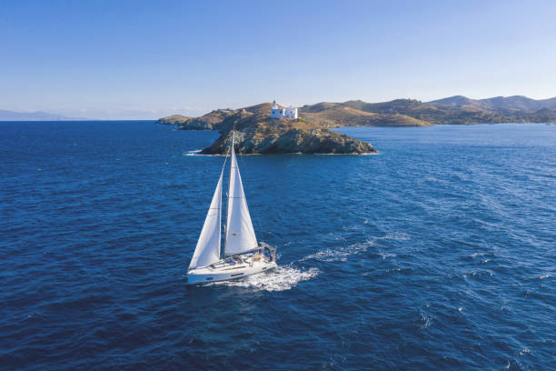 istock Sailing boat with white sails, rippled sea background 1281462962