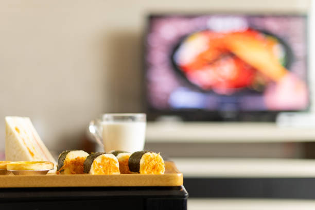 istock healthy breakfast in a living room with a TV broadcasting a food making programme 1281464088